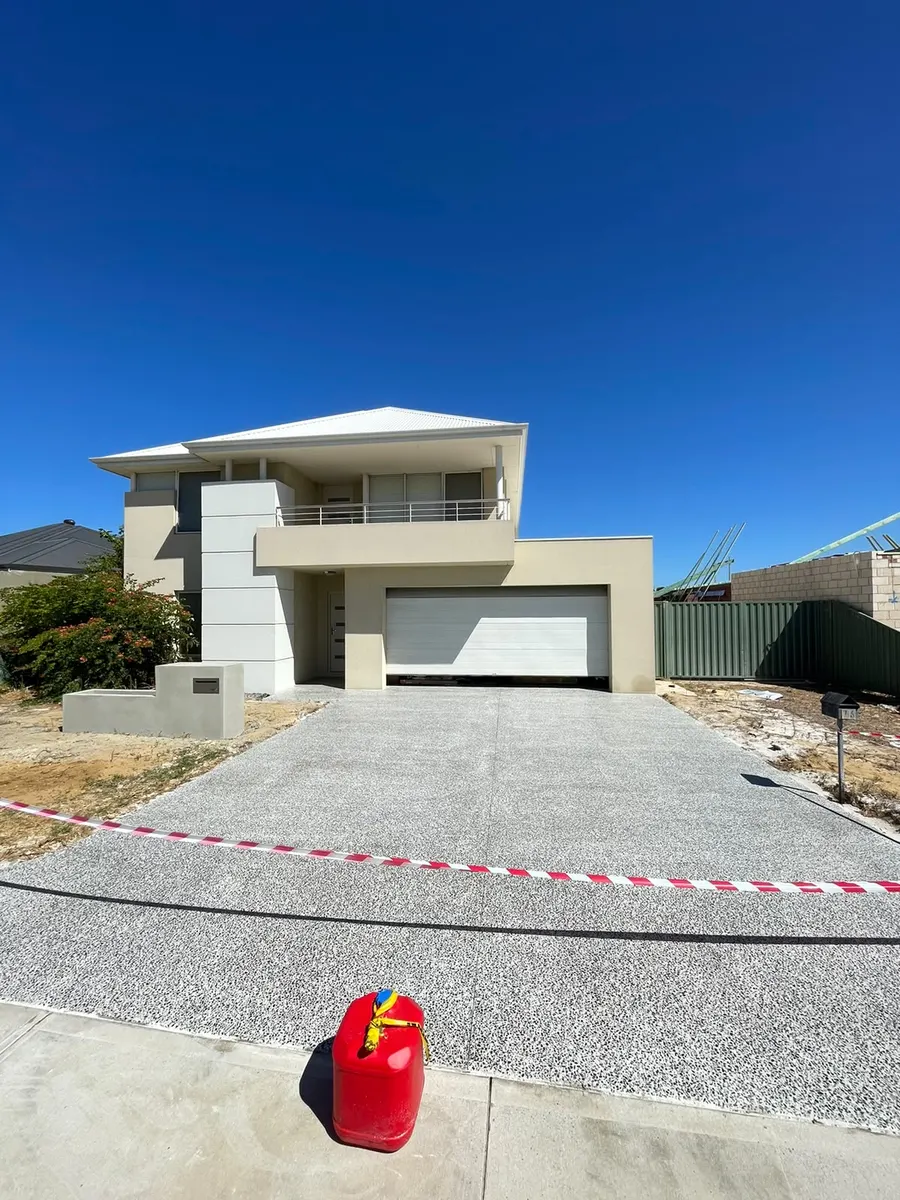 Honed aggregate driveway on a new Perth build